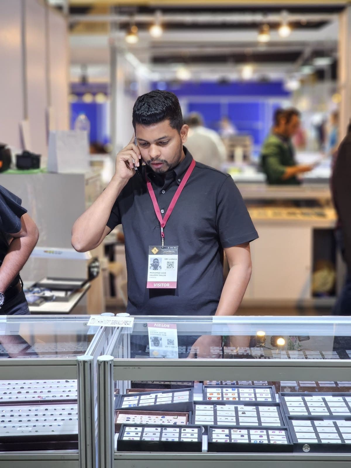 Aasir Thajir viewing stones at the Bangkok Gems & Jewelry Fair